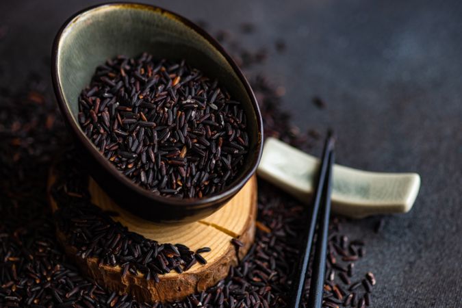 Organic dark rice in ceramic bowl