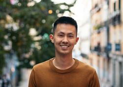 Portrait of a smiling Asian man outdoors