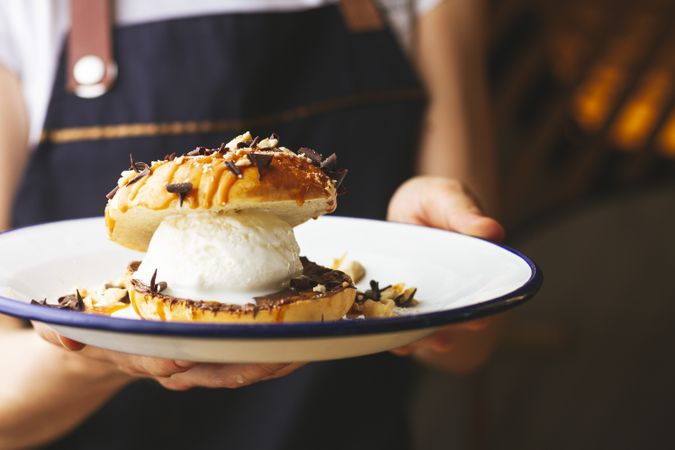 Tasty sweet burger with chocolate crumb and nuts