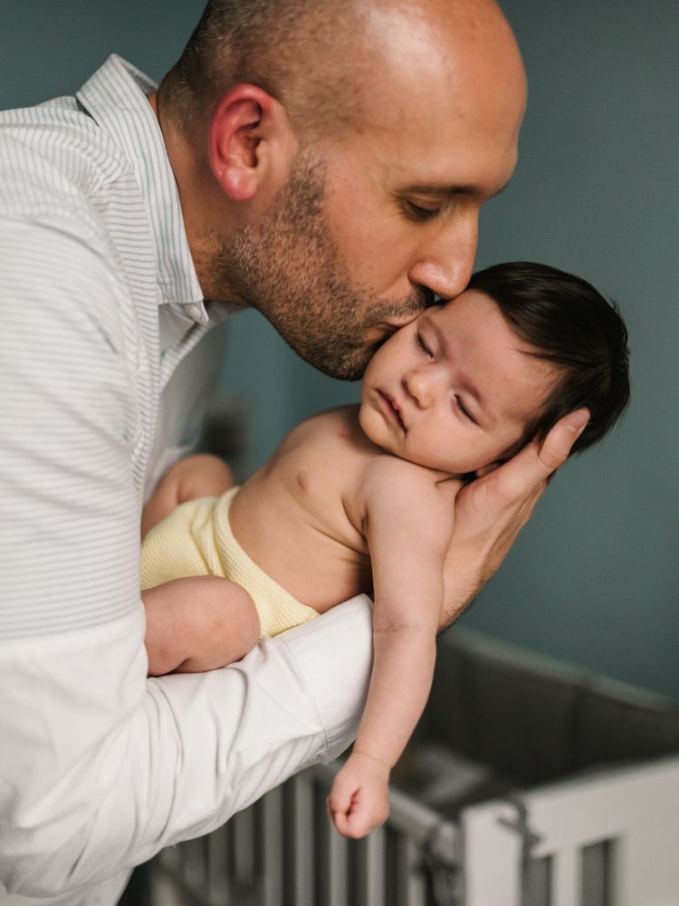 Father hugging cute baby