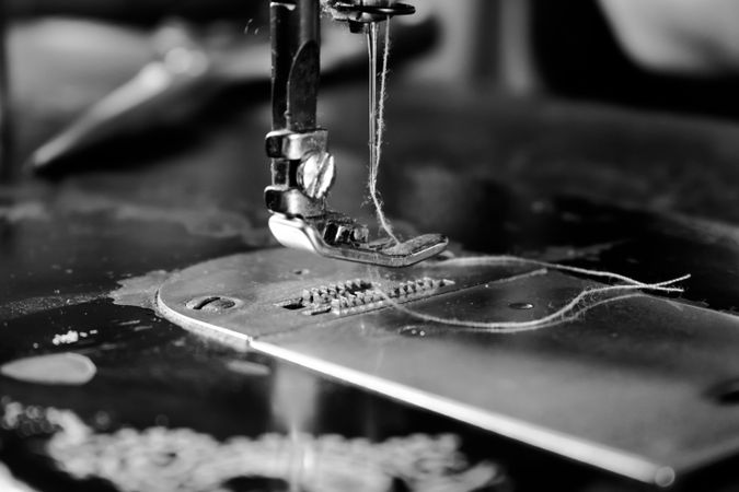 Close up of sewing machine needle