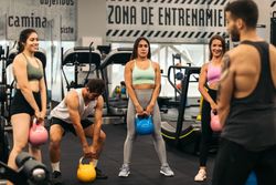 fitness class lifting kettlebells in a gym