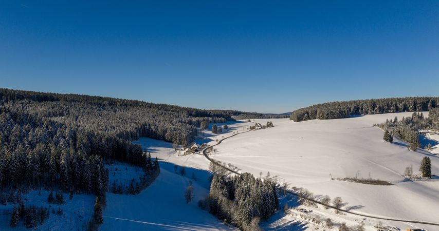 Deep snow winter in the mountains, drone aerial view