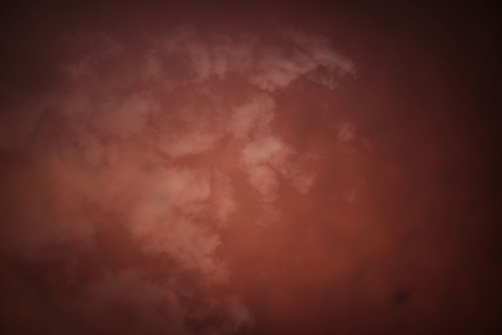 Smoke over water in brown light