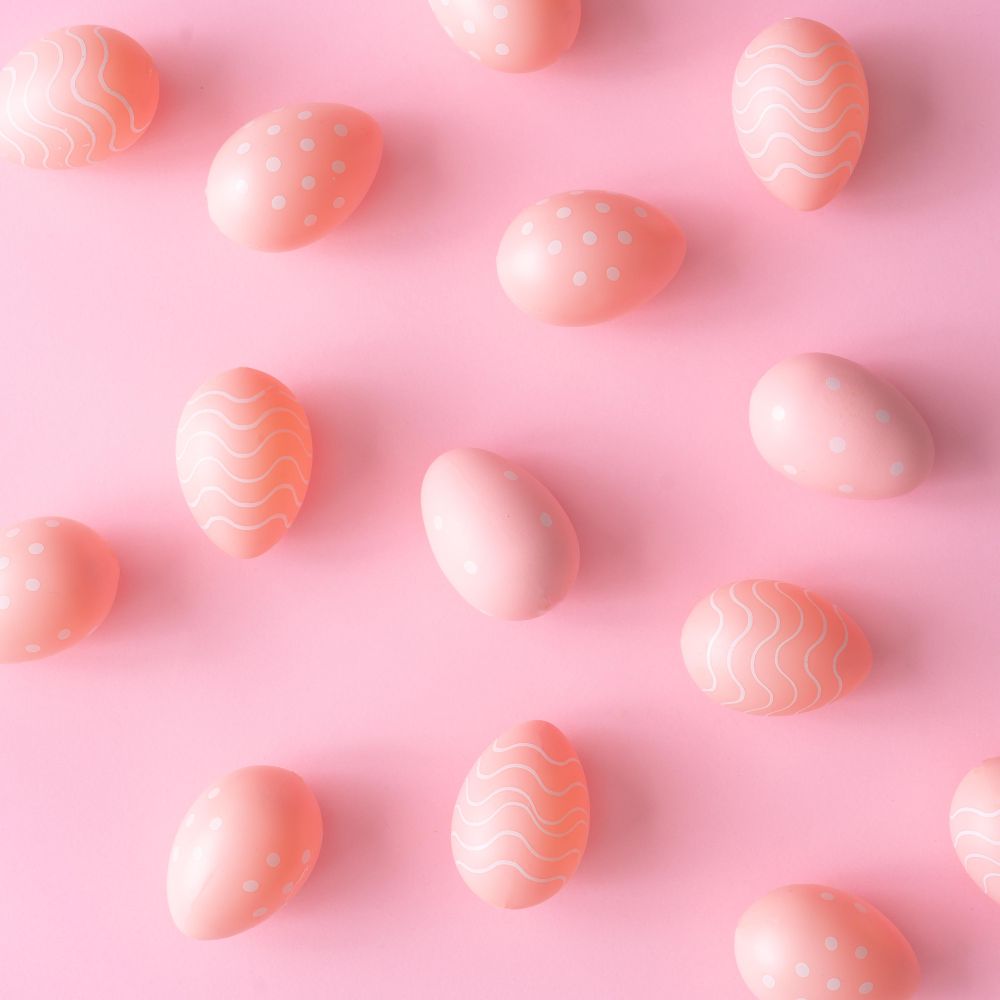 Pink Easter eggs on pink table