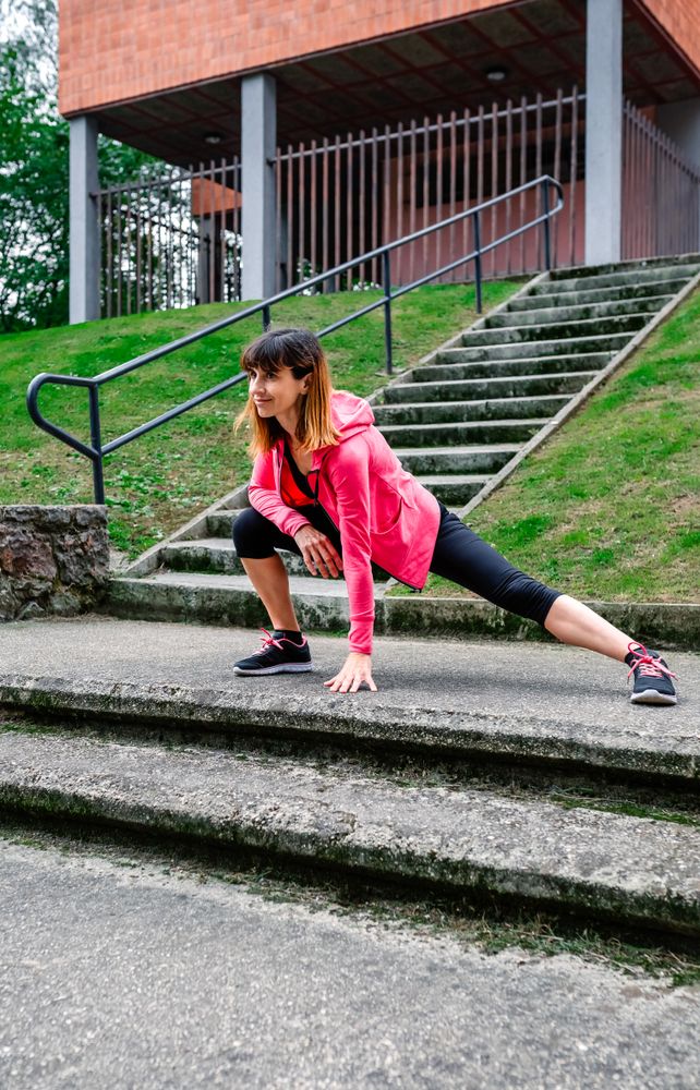 Female athlete doing stretching outdoors
