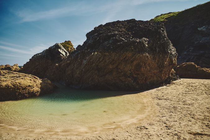 Small pool of water in a rocky cove