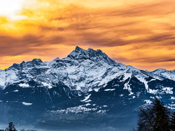 Swiss Alps winter landscape with snow and sun, mountains in Europe