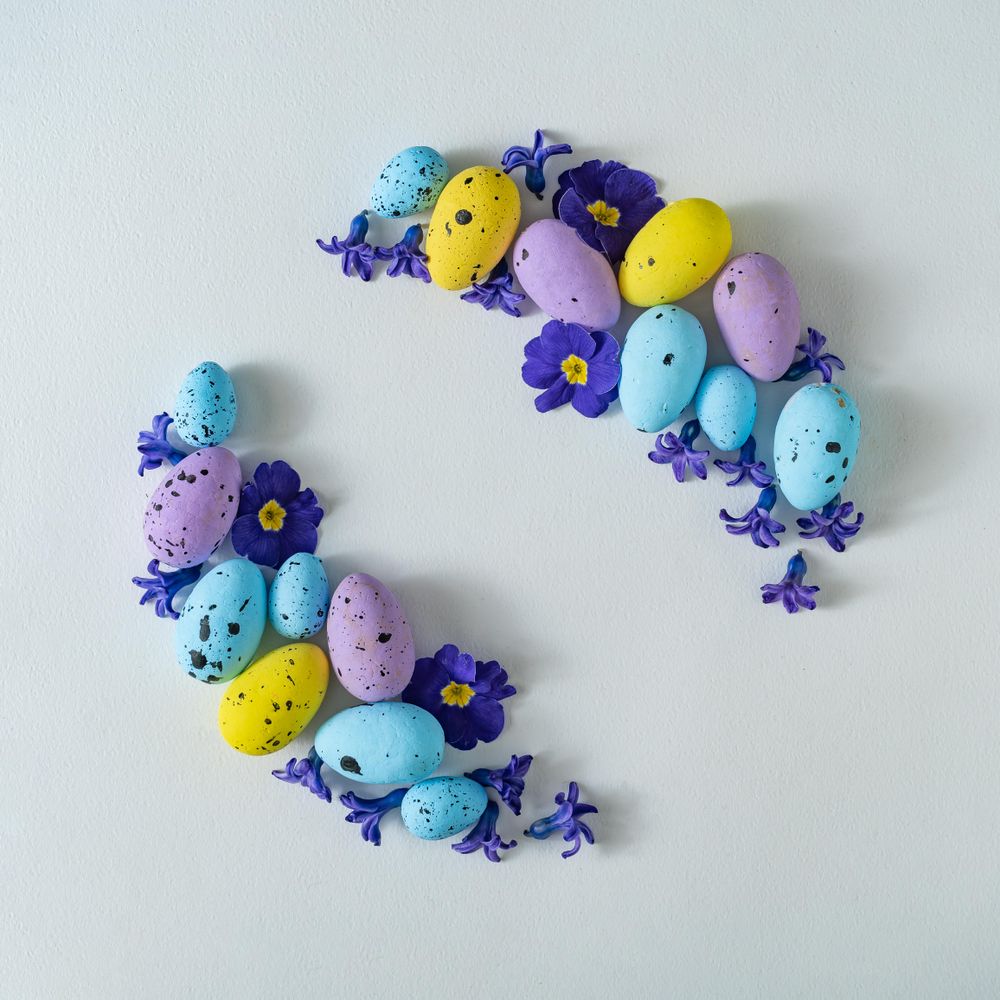 Easter eggs and purple flowers and leaves