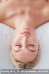 Face of blonde woman lying back and relaxing after treatment 5oDV7y