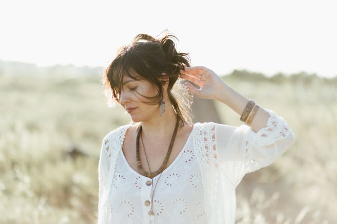 Charming smiling woman with trendy accessories outdoors