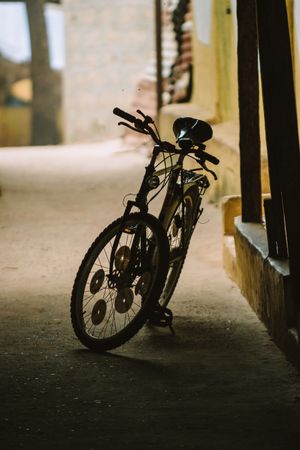 Bicycle parked on dark street