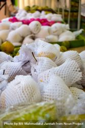 Fruits wrapped and for sale in produce market 49mB7Q