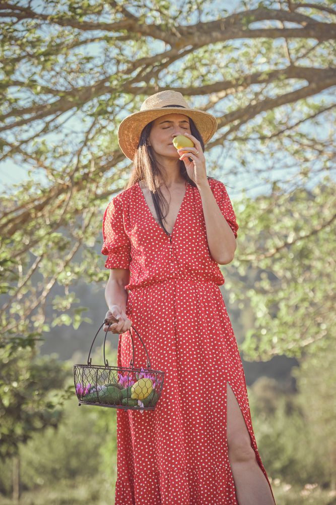 Woman with fruit basket of meadow