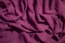 Soft purple fabric wavy crumpled background abstract.