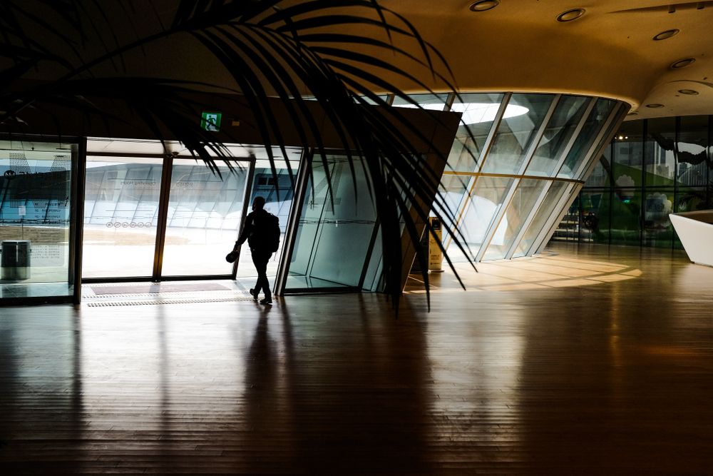 Man exiting modern style building