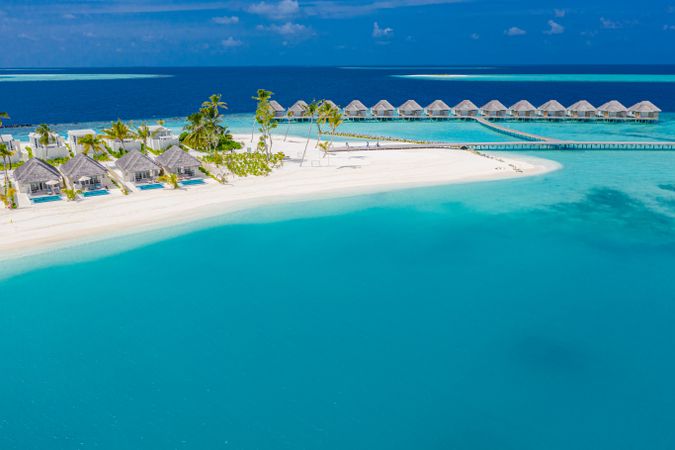 Holiday villas, and over water bungalows in a tropical beach resort