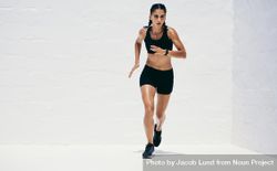 Athletic woman performing running exercises 4jrlx4