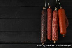 Variety of sausages hanging in a row, copy space 4ZYP95