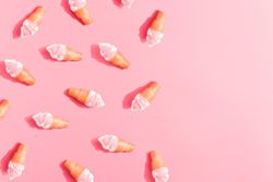 Ice cream in cones on pink background
