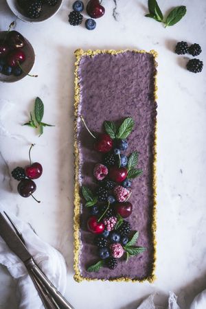 Fresh blueberry pistachio cake with whole berries on top