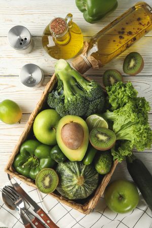 Concept of healthy food with vegetables and fruits on wooden table