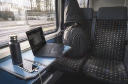 Swiss train interior with traveler luggage