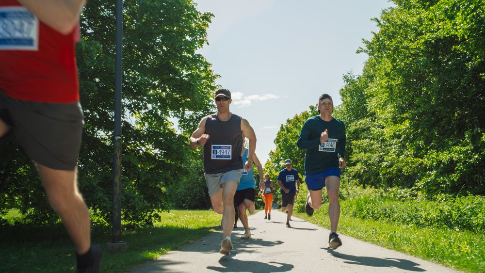 Joggers Giving their Best to Achieve the Finish Line in a Friendly Race