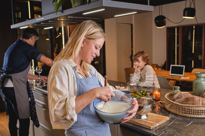 Happy family cooking in kitchen