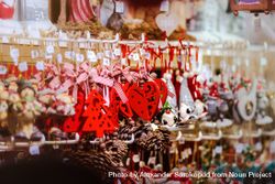 Red Christmas ornaments on sale in market in Strasbourg, Alsace, France 56YpY0
