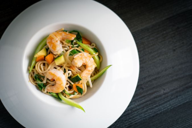 Tasty Pad Thai of vegetables and prawns in plate