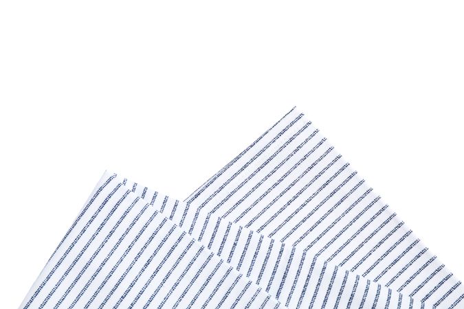 Folded fabric napkin isolated on plain background