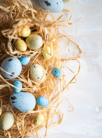 Close up of Easter eggs surrounded with hay