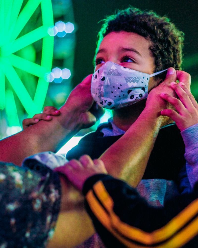 Young boy wearing facemask at night