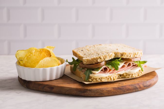 Delicious sandwich with ham, cheese, lettuce and tomato