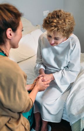 Doctor giving encouragement to mature patient