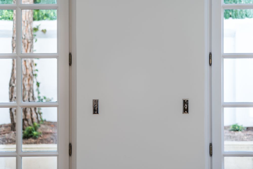 House wooden doors to balcony with latches
