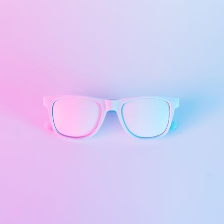 Sunglasses in vibrant bold gradient purple and blue holographic colors