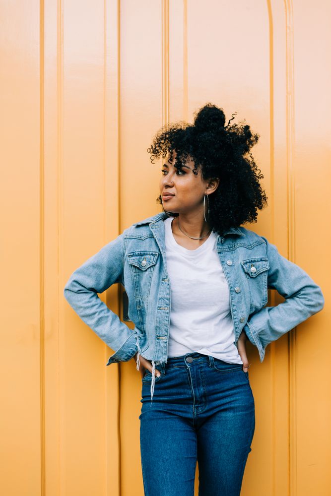 Stylish female by yellow door