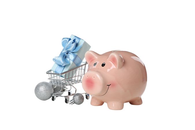 Piggy bank, gift box and shopping cart, isolated on light background