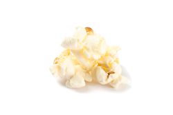 Piece of popcorn isolated on blank background, close up
