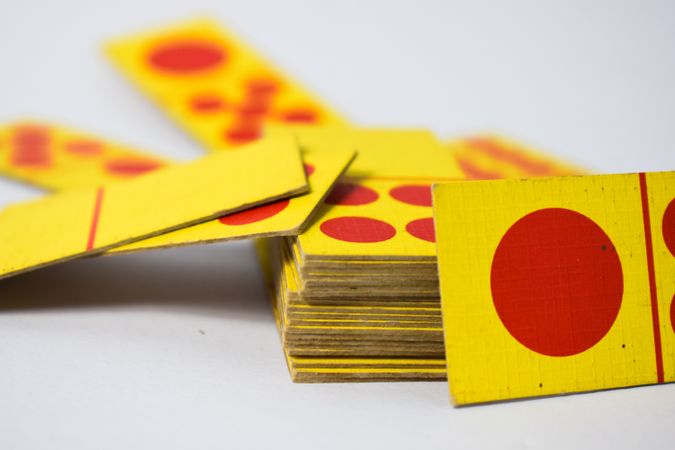 Close up of red and yellow domino cards