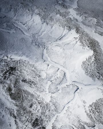 Aerial shot of wintry rugged terrain in Iceland