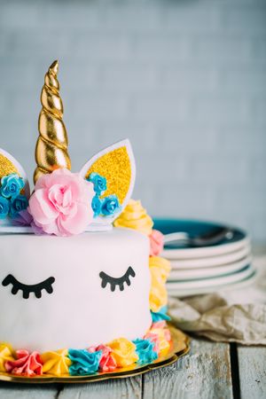 Cute unicorn cake with painted closed eyes