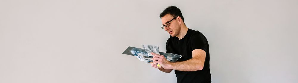 Builder working picking plaster with spatula