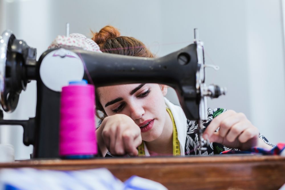 Woman in a sewing school
