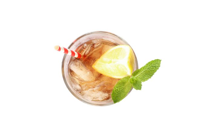 Glass of cold cola with lemon isolated on blank background