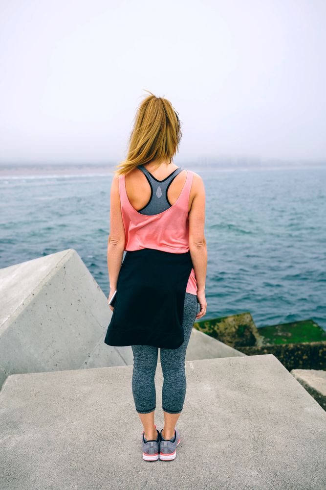Unrecognizable young woman watching the sea
