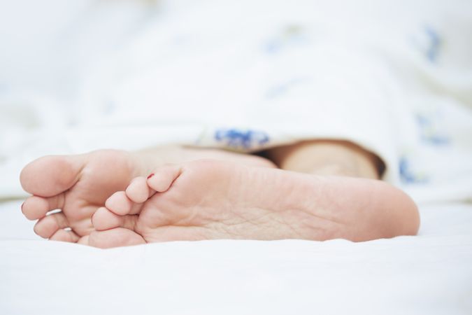 Feet of sleeping woman