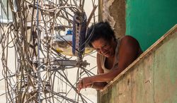 Rio de Janeiro, Brazil - February 13 2014: Laughing woman on shabby balcony